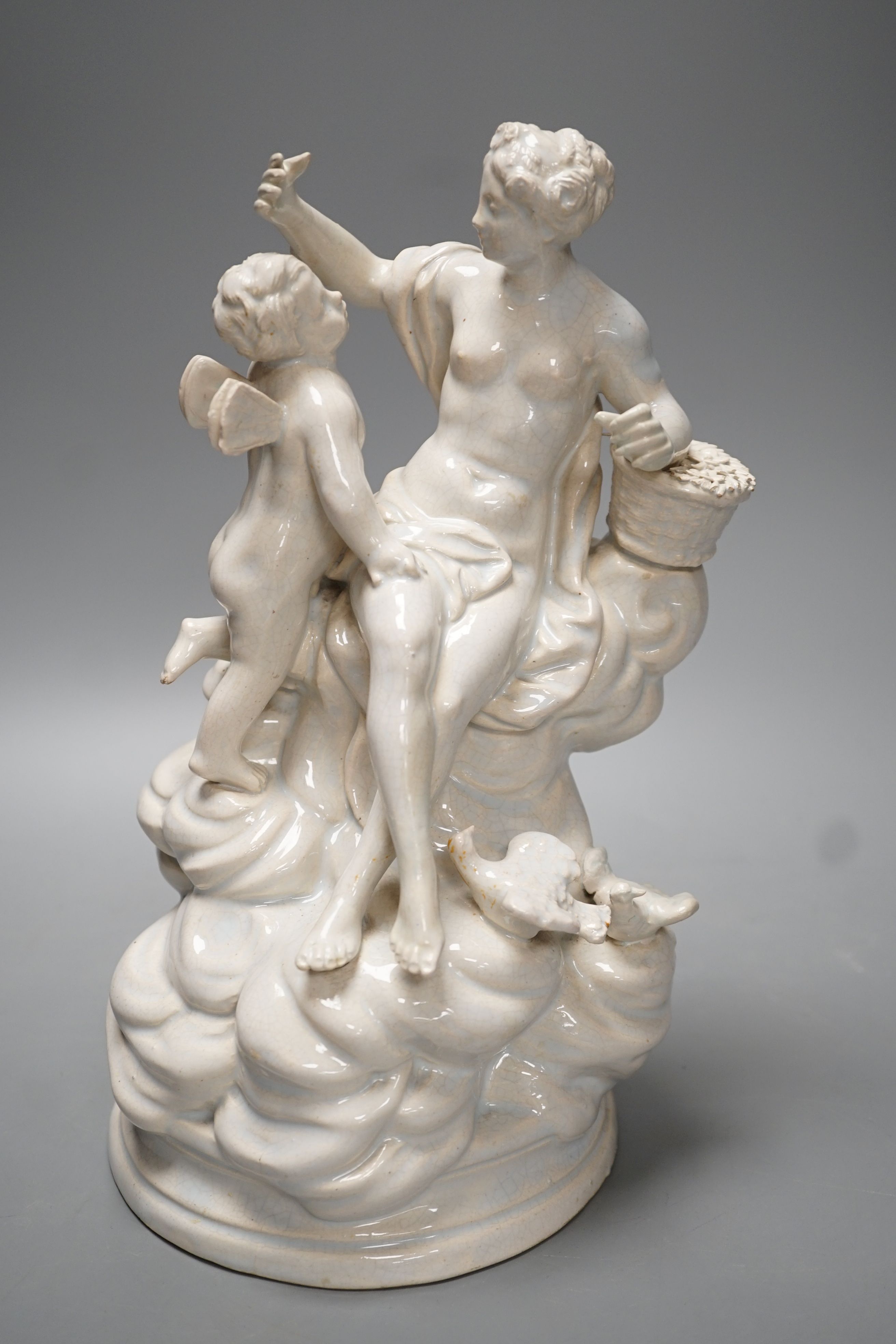 A 19th century Naples style maiolica group of Venus and Cupid - 26.5cm high